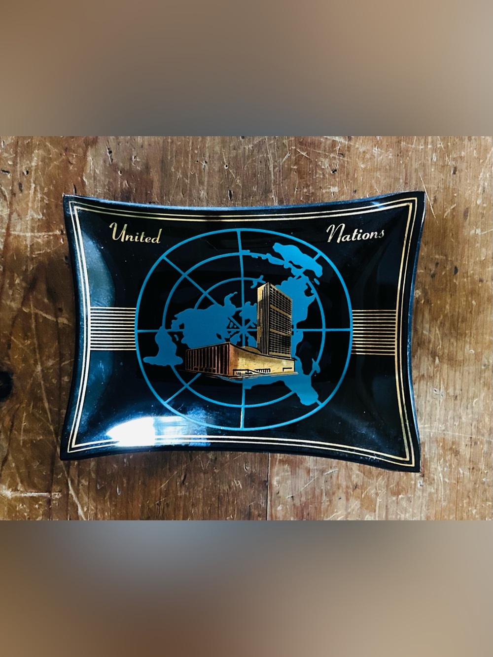 Vintage United Nations HQ NYC commemorative glass ashtray.